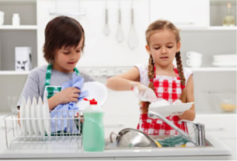 little boy and girl washing dishes